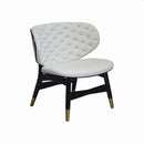 BUTACA ESTACIONARIA TAPIZADA EN PU COLOR  BLANCO Y PATAS NEGRAS CON CASQUILLOS DORADOS