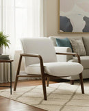 BUTACA ESTACIONARIA EN TELA BEIGE Y PATAS ACABADO DE MADERA