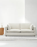 SOFA ESTACIONARIO DE TRES ASIENTOS EN TELA BEIGE CREMA