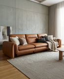 SOFA ESTACIONARIO DE CUATRO ASIENTOS CON FRENTE DE PIEL NARANJA