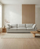 SOFA ESTACIONARIO DE TRES ASIENTOS EN TELA BEIGE