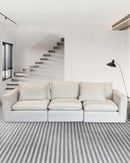 SOFA ESTACIONARIO DE TRES ASIENTOS EN TELA BEIGE