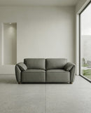SOFA ESTACIONARIO DE DOS ASIENTOS EN FRENTE DE PIEL VERDE
