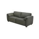 SOFA ESTACIONARIO DE DOS ASIENTOS EN FRENTE DE PIEL VERDE