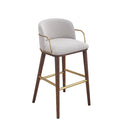 TABURETE EN TELA GRIS CON PATAS ACABADO DE MADERA Y ACERO DORADO